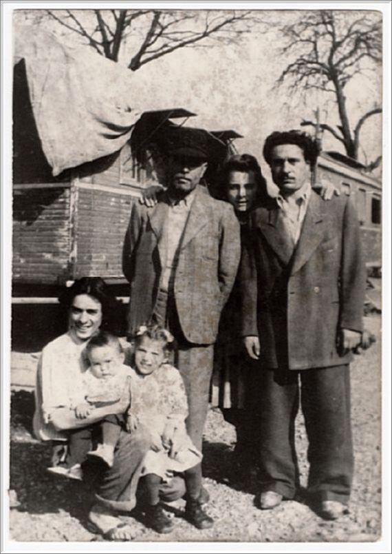 German gypsy family in front of their caravans